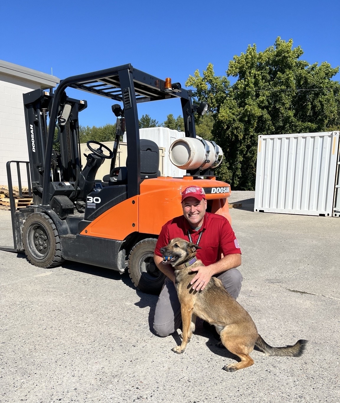 Wayne Michael Bell with a U.S. Customs and Border Protection working dog during equipment safety work
